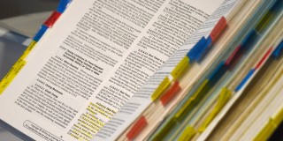 dissertation notebook with colored page clips