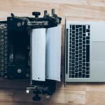 typewriter and laptop computer